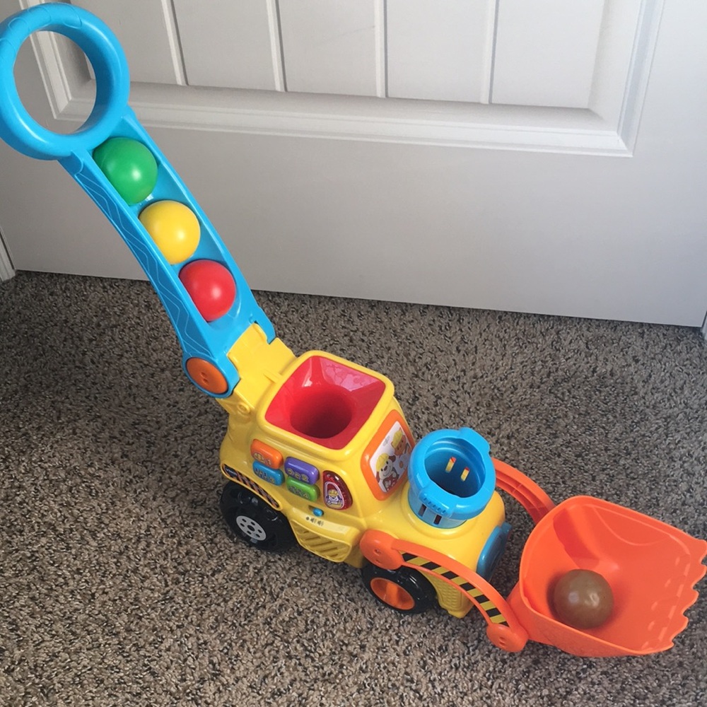 V-tech pop-a-balls push dozer